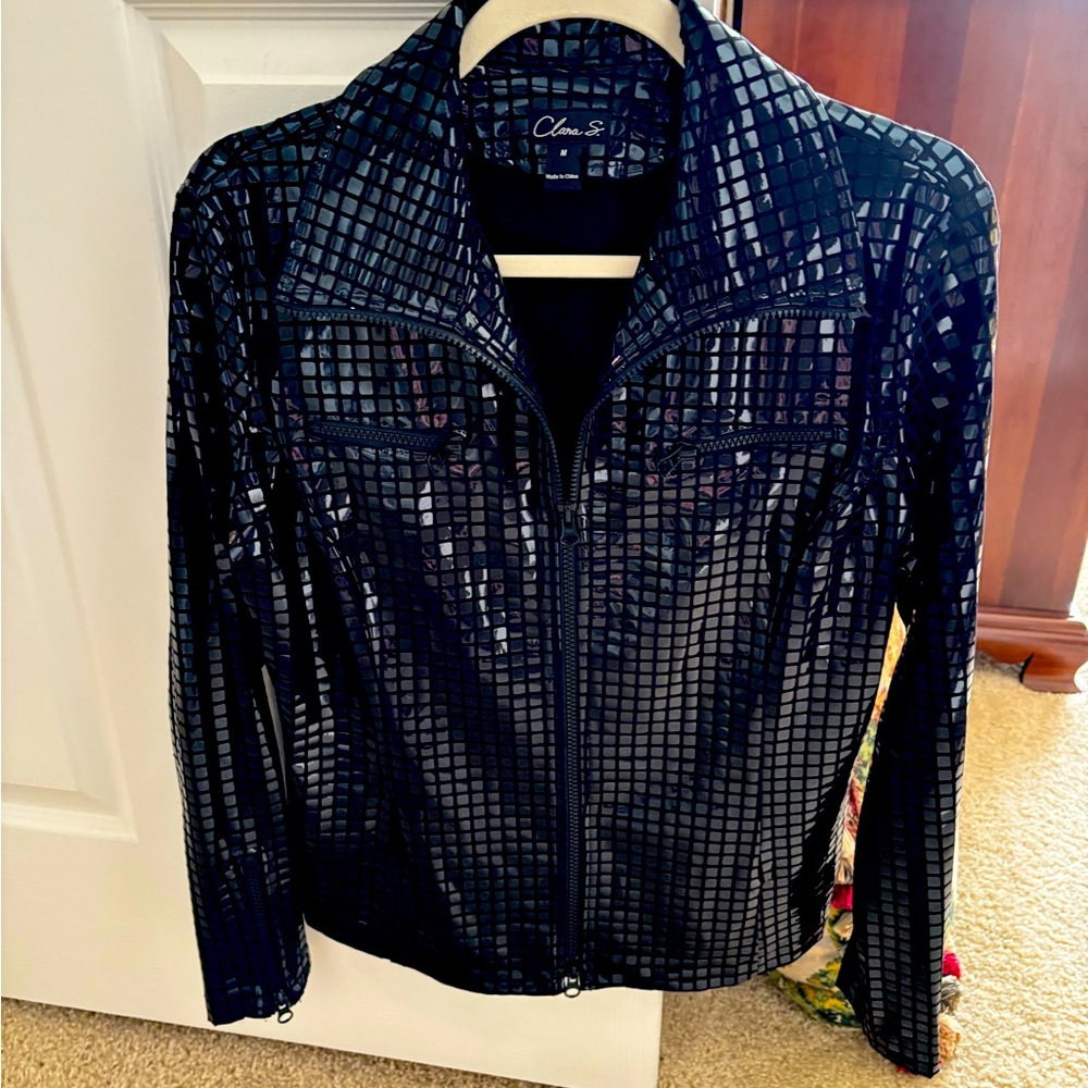 On trend cropped black jacket with zipper front.
